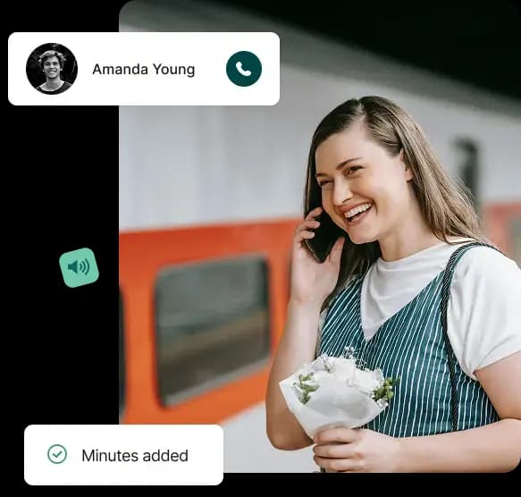 A lady talking on phone with flowers
